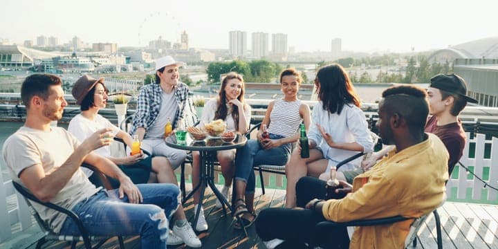 A group of people talking at a social gathering